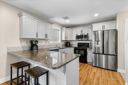 87 Almond Crescent, Blackfalds, AB - Indoor Photo Showing Kitchen With Double Sink