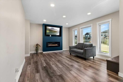 87 Almond Crescent, Blackfalds, AB - Indoor Photo Showing Living Room With Fireplace