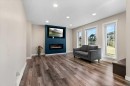 87 Almond Crescent, Blackfalds, AB  - Indoor Photo Showing Living Room With Fireplace 