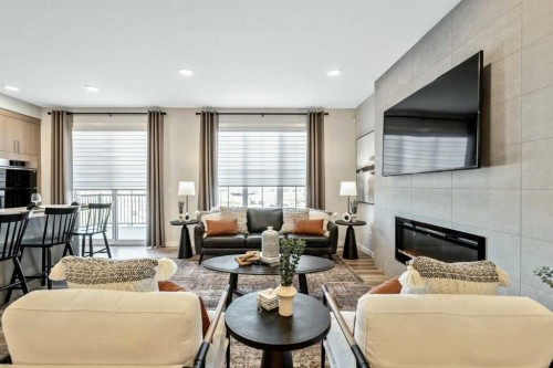 146 Osprey Hill Way Sw, Calgary, AB - Indoor Photo Showing Living Room With Fireplace