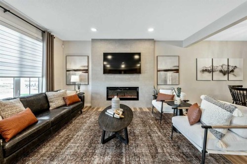 146 Osprey Hill Way Sw, Calgary, AB - Indoor Photo Showing Living Room With Fireplace