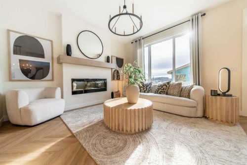152 Snowberry Common Se, Calgary, AB - Indoor Photo Showing Living Room With Fireplace