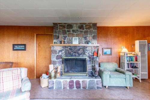 60 Beach Avenue, Itaska Beach, AB - Indoor Photo Showing Living Room With Fireplace
