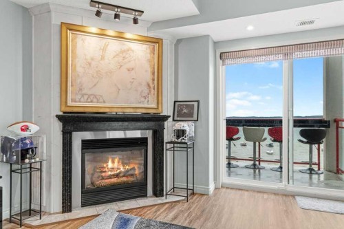 401-5100 Lakeshore Drive, Sylvan Lake, AB - Indoor Photo Showing Other Room With Fireplace