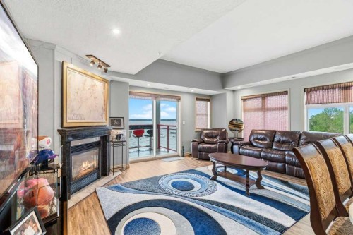 401-5100 Lakeshore Drive, Sylvan Lake, AB - Indoor Photo Showing Living Room With Fireplace