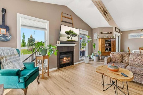 38 Lucky Place, Sylvan Lake, AB - Indoor Photo Showing Living Room With Fireplace