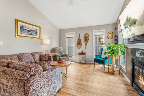 38 Lucky Place, Sylvan Lake, AB - Indoor Photo Showing Living Room With Fireplace