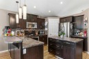 38 Lucky Place, Sylvan Lake, AB  - Indoor Photo Showing Kitchen With Stainless Steel Kitchen With Double Sink With Upgraded Kitchen 