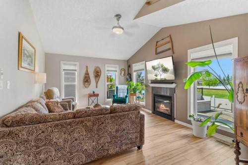 38 Lucky Place, Sylvan Lake, AB - Indoor Photo Showing Living Room With Fireplace