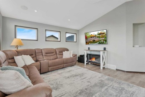 50 Wilkinson Circle, Sylvan Lake, AB - Indoor Photo Showing Living Room With Fireplace