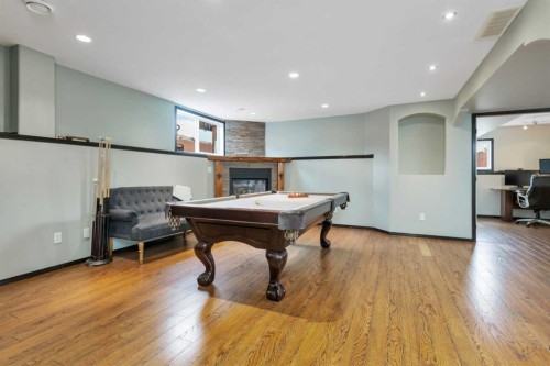 50 Wilkinson Circle, Sylvan Lake, AB - Indoor Photo Showing Other Room With Fireplace