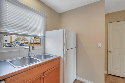 7-15 Stanton Street, Red Deer, AB - Indoor Photo Showing Kitchen With Double Sink