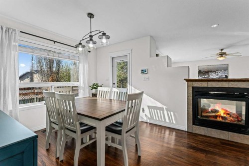 199 Adams Close, Red Deer, AB - Indoor Photo Showing Dining Room With Fireplace