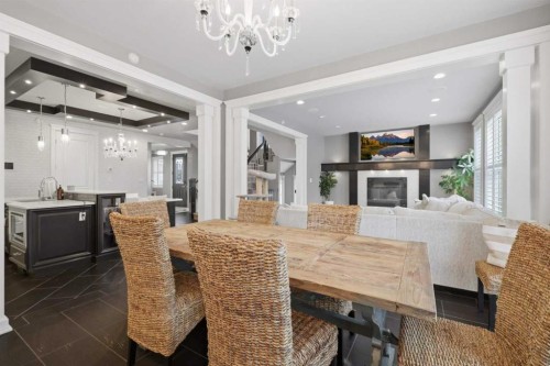 1 Rosewood Rise, Sylvan Lake, AB - Indoor Photo Showing Dining Room With Fireplace