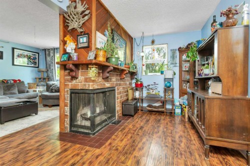4520 36 Avenue, Ponoka, AB - Indoor Photo Showing Living Room With Fireplace