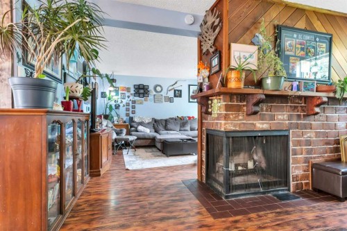 4520 36 Avenue, Ponoka, AB - Indoor Photo Showing Living Room With Fireplace