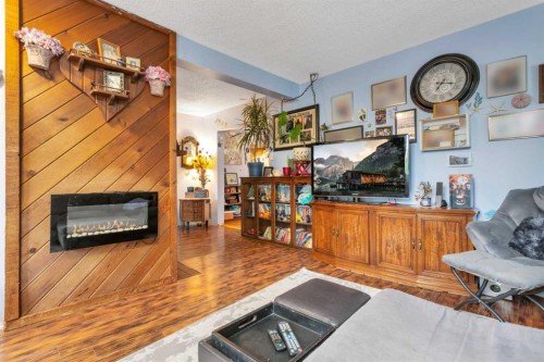 4520 36 Avenue, Ponoka, AB - Indoor Photo Showing Living Room With Fireplace
