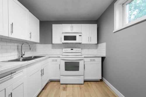5219 50 Avenue, Camrose, AB - Indoor Photo Showing Kitchen With Double Sink