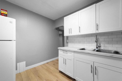 5219 50 Avenue, Camrose, AB - Indoor Photo Showing Kitchen With Double Sink