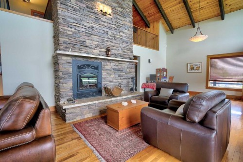 37311 Range Road 283, Rural Red Deer County, AB - Indoor Photo Showing Living Room With Fireplace