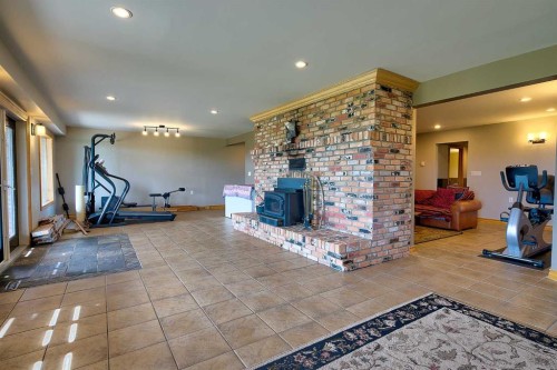 37311 Range Road 283, Rural Red Deer County, AB - Indoor Photo Showing Other Room With Fireplace