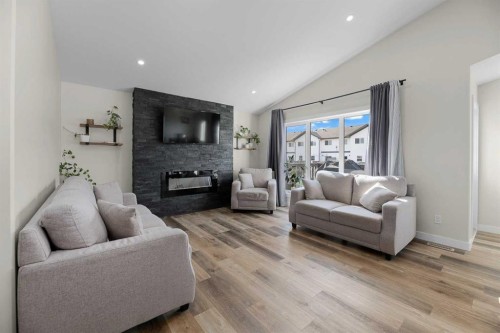 4761 Aspen Lakes Boulevard, Blackfalds, AB - Indoor Photo Showing Living Room With Fireplace