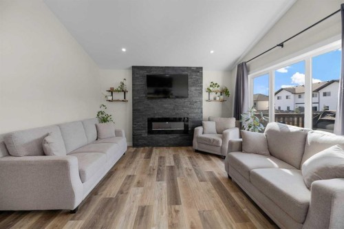 4761 Aspen Lakes Boulevard, Blackfalds, AB - Indoor Photo Showing Living Room With Fireplace