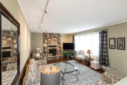 5015 35 Street, Innisfail, AB - Indoor Photo Showing Living Room With Fireplace