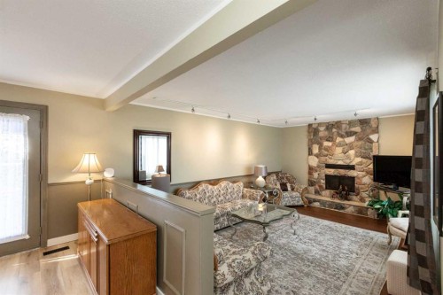 5015 35 Street, Innisfail, AB - Indoor Photo Showing Living Room With Fireplace
