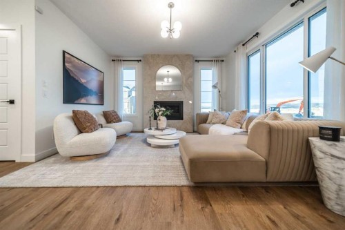 24 Southborough Common, Cochrane, AB - Indoor Photo Showing Living Room With Fireplace