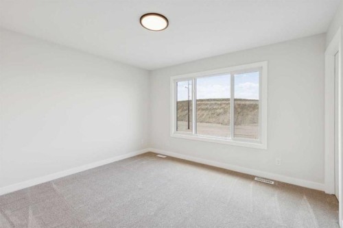 24 Southborough Common, Cochrane, AB - Indoor Photo Showing Other Room