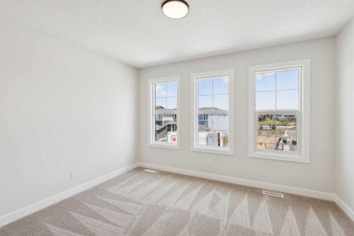24 Southborough Common, Cochrane, AB - Indoor Photo Showing Other Room