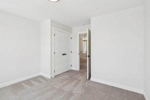 24 Southborough Common, Cochrane, AB - Indoor Photo Showing Other Room