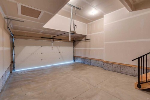 24 Southborough Common, Cochrane, AB - Indoor Photo Showing Garage
