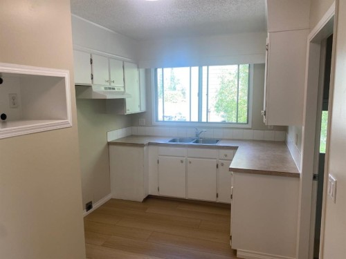 6321-B Enevold Drive, Camrose, AB - Indoor Photo Showing Kitchen With Double Sink