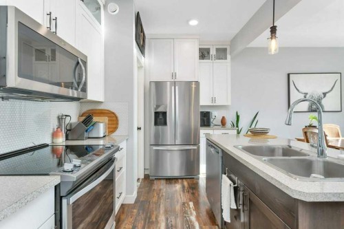14 Mckay Boulevard, Blackfalds, AB - Indoor Photo Showing Kitchen With Double Sink With Upgraded Kitchen