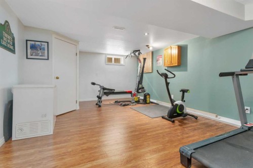 5108 49 Street, Clive, AB - Indoor Photo Showing Gym Room