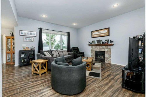 9 Henner'S Outlook, Lacombe, AB - Indoor Photo Showing Living Room With Fireplace
