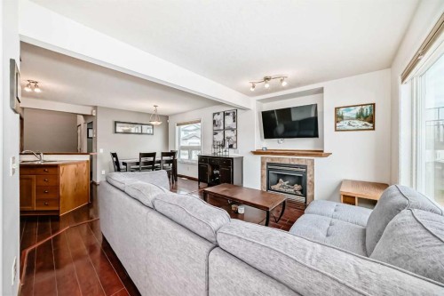 102-6220 Orr Drive, Red Deer, AB - Indoor Photo Showing Living Room With Fireplace