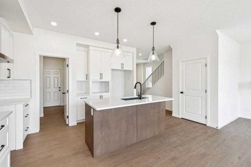 28 Southborough Bay, Cochrane, AB - Indoor Photo Showing Kitchen With Upgraded Kitchen