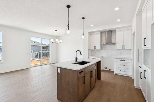 28 Southborough Bay, Cochrane, AB - Indoor Photo Showing Kitchen With Upgraded Kitchen