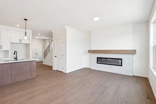 28 Southborough Bay, Cochrane, AB - Indoor With Fireplace