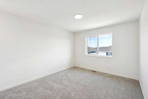 28 Southborough Bay, Cochrane, AB - Indoor Photo Showing Other Room