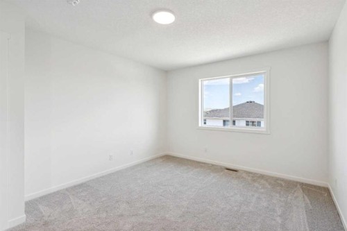 28 Southborough Bay, Cochrane, AB - Indoor Photo Showing Other Room