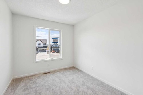 28 Southborough Bay, Cochrane, AB - Indoor Photo Showing Other Room