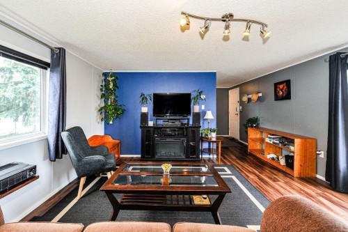 16 Main Street, Edberg, AB - Indoor Photo Showing Living Room With Fireplace