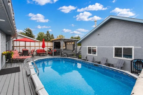 8 Caswell Close, Red Deer, AB - Outdoor With Above Ground Pool With Deck Patio Veranda With Exterior