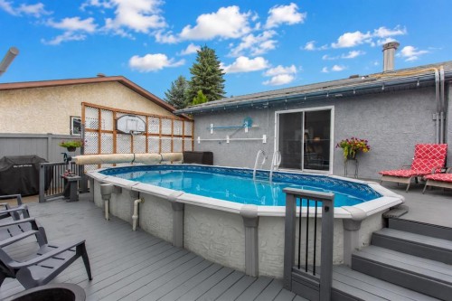 8 Caswell Close, Red Deer, AB - Outdoor With Above Ground Pool With Deck Patio Veranda With Exterior