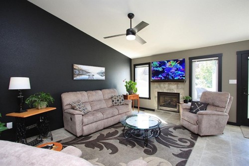 310B Edgewood Close, Camrose, AB - Indoor Photo Showing Living Room With Fireplace