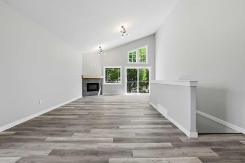 5242 51 Street, Lacombe, AB - Indoor Photo Showing Other Room With Fireplace